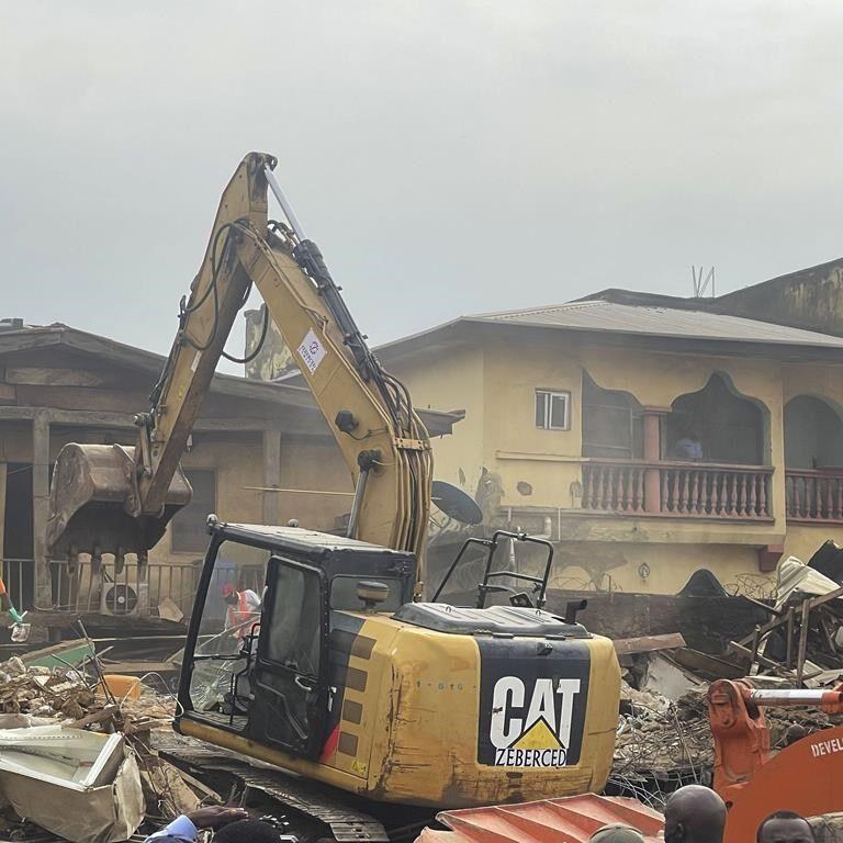 Building collapse in Nigeria's capital leaves two people dead while many are feared trapped